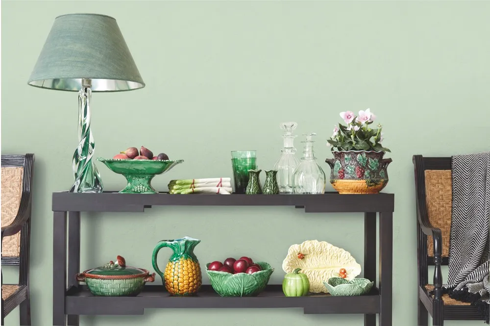 A display of quirky fruit and vegetable ceramics on a living room sideboard.