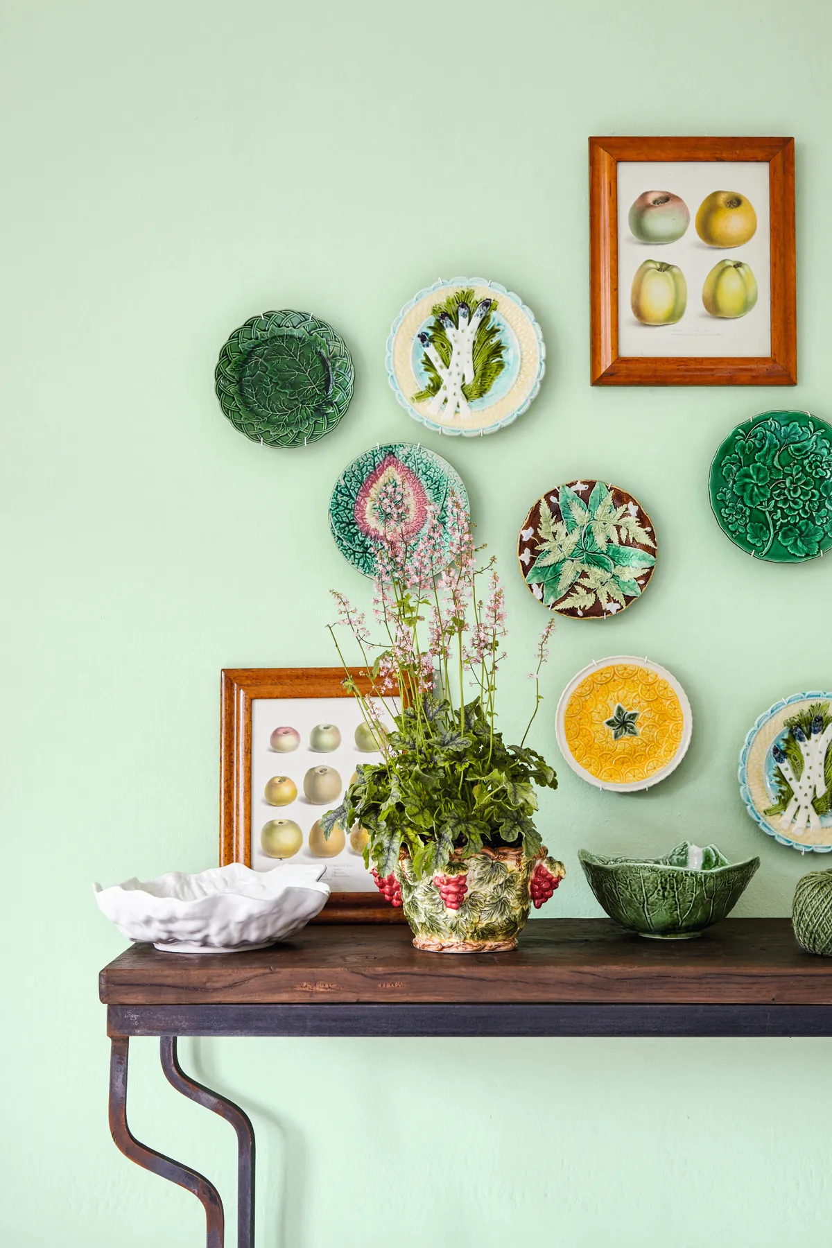 Create a welcoming hallway with a decorative display of plates and bowls in complementary shades. Pair with vintage botanical prints for a cohesive look.