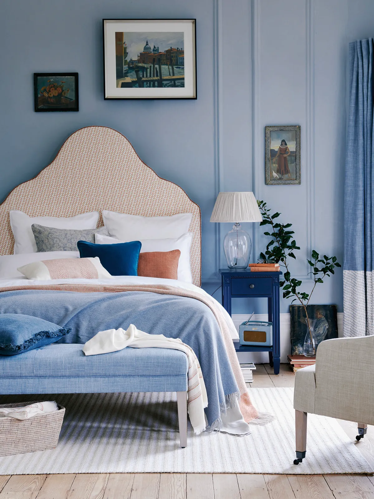 a headboard in a warm colour will make a blue room less cold. Clemmie headboard, from £370, Neptune.