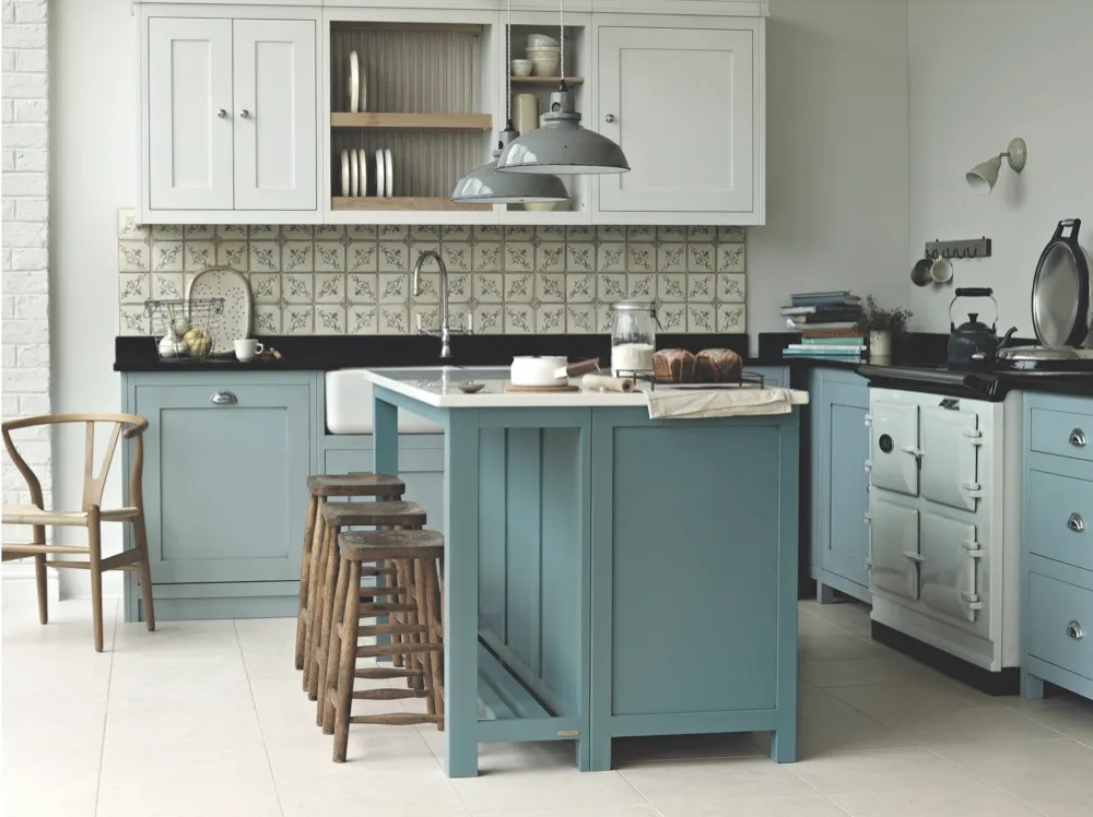'Vermont' kitchen by Fired Earth. Cabinets painted in 'Dover Cliffs' and 'Smoke Blue'; island unit is in 'Andaman Sea' with a Caesarstone worktop. Prices start at around £10,000