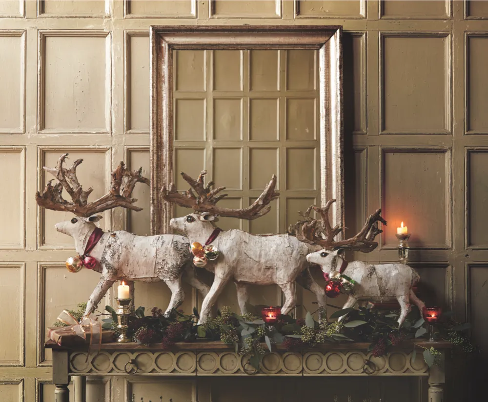 A collection of birch reindeer on display