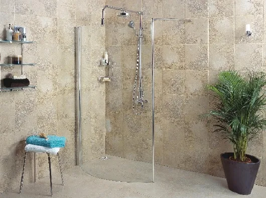 A shower in a wetroom enclosed by a single piece of glass