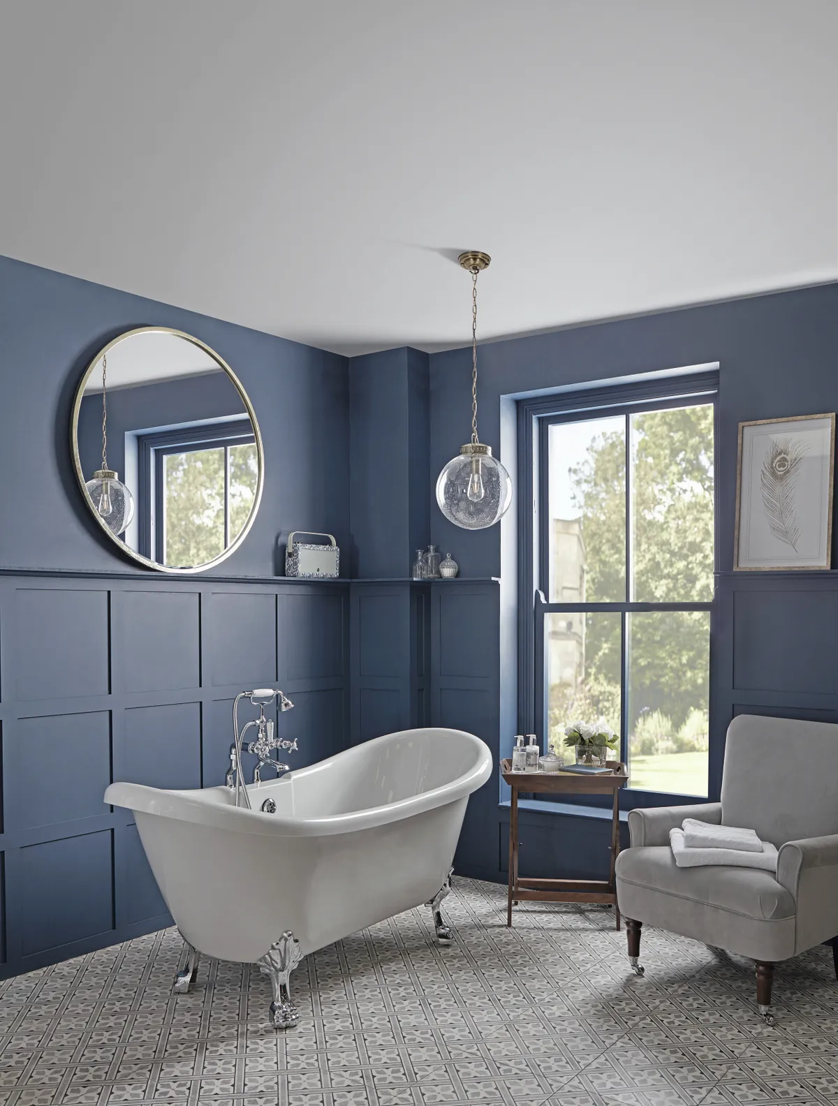 A traditional bathroom with dark blue walls