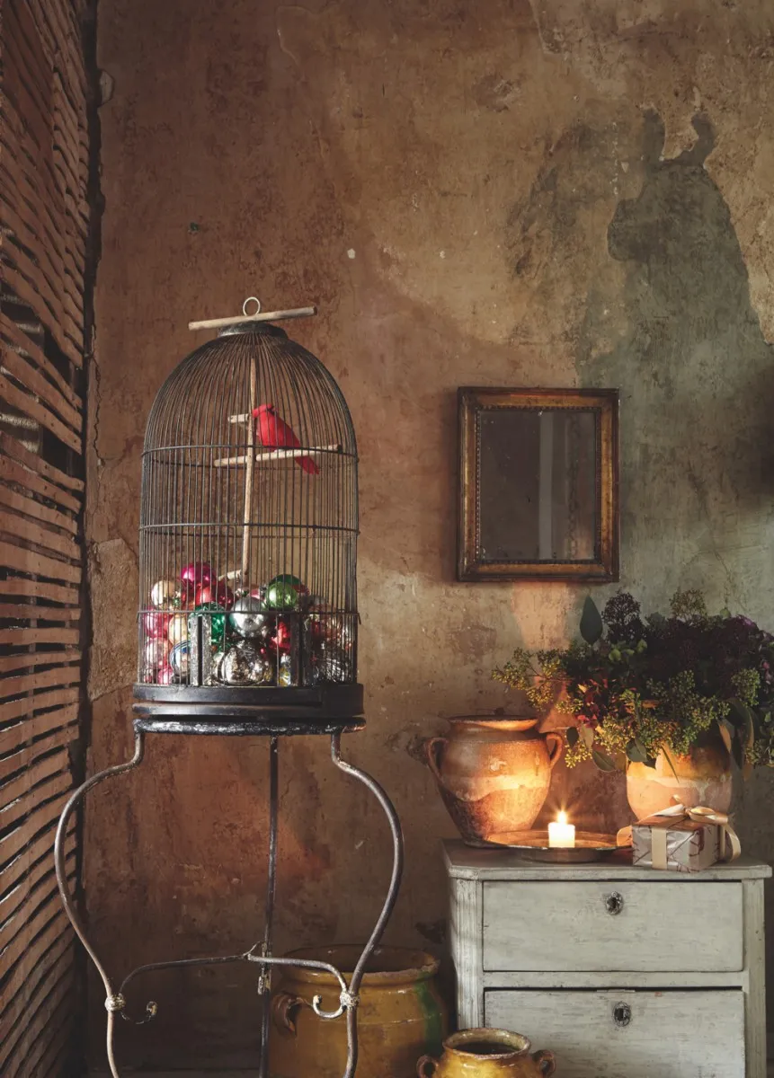 A birdcage filled with baubles