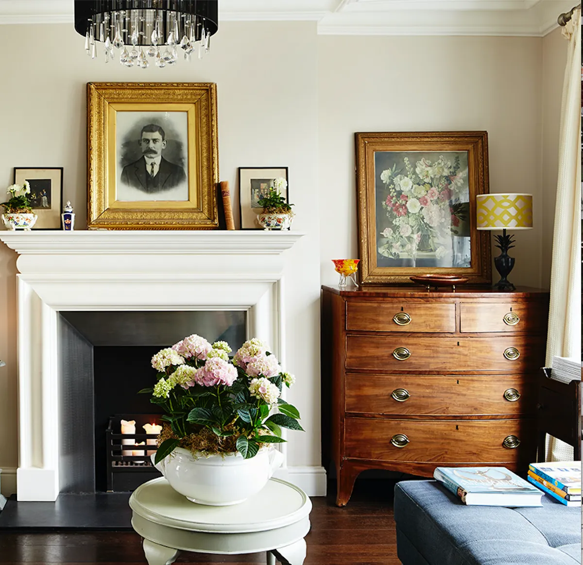 A Georgian bow-fronted chest of drawers in a traditional Georgian living room