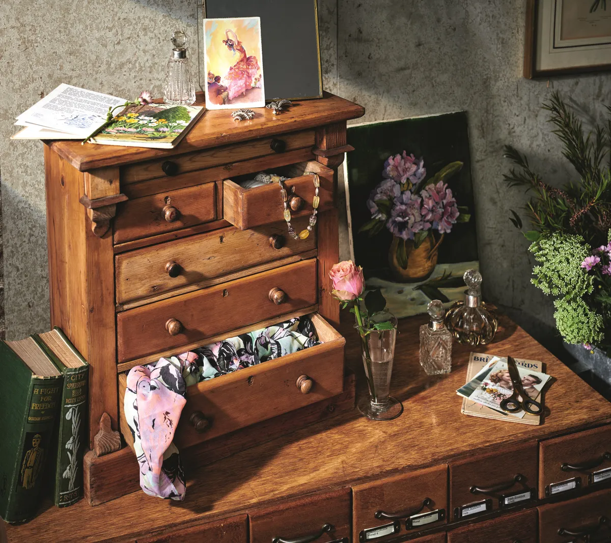 A vintage drawer unit on a dressing table used to store make up, jewellery and scarves