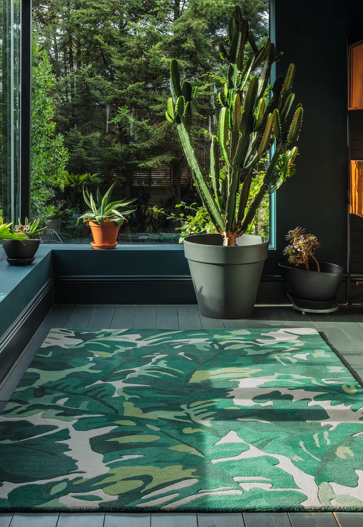 Channel the vibrancy of a rainforest with this tropical design. Large Palm Jungle Green Tropical rug, £499, Audenza.
