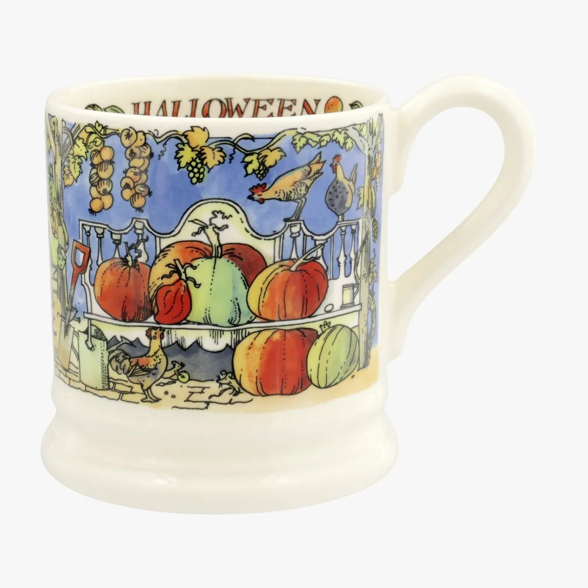 A midnight blue and white halloween mug from Emma Bridgewater featuring painted pumpkins