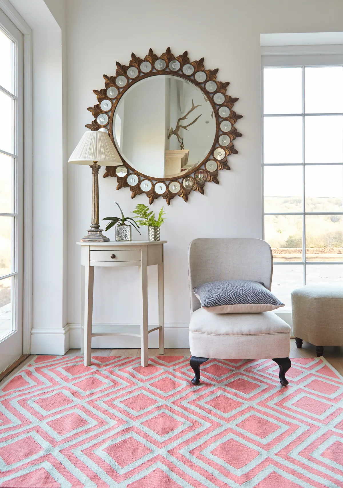 The coral hue of this rug sings against pale flooring, while the diamond pattern is classic enough to complement traditional schemes. Coral Iris rug, from £138, Weaver Green.