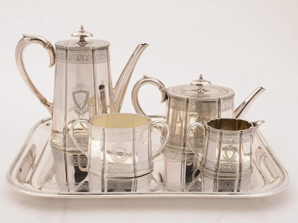 Silver tea and coffee set on a silver tray