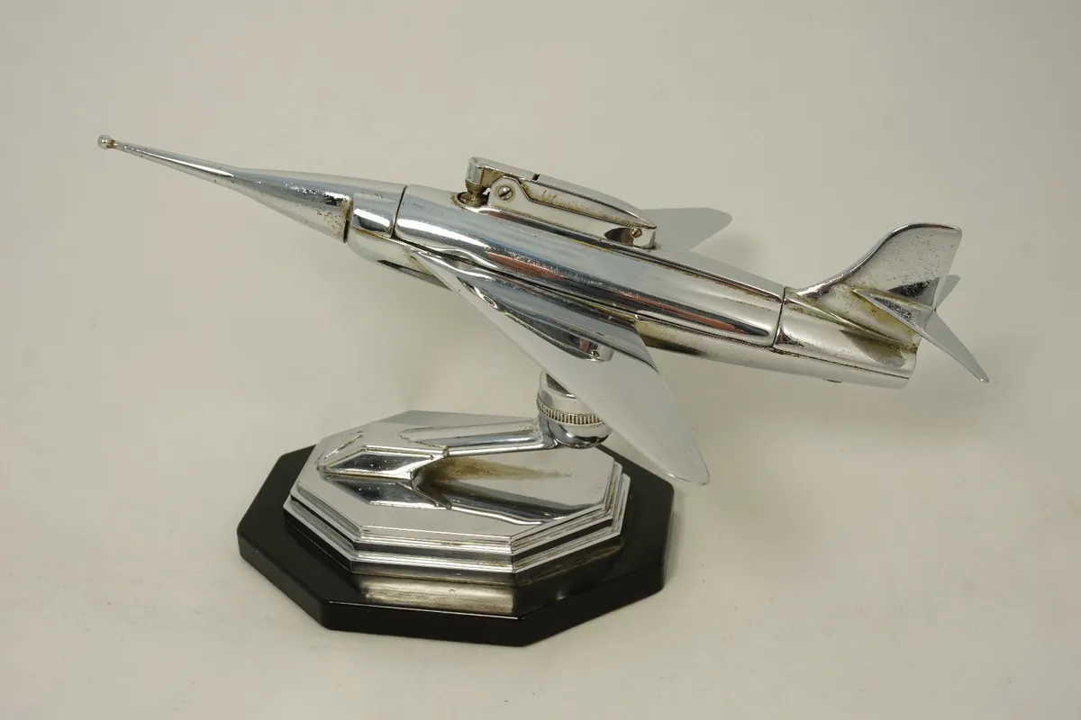 Chrome table lighter in shape of jet plane