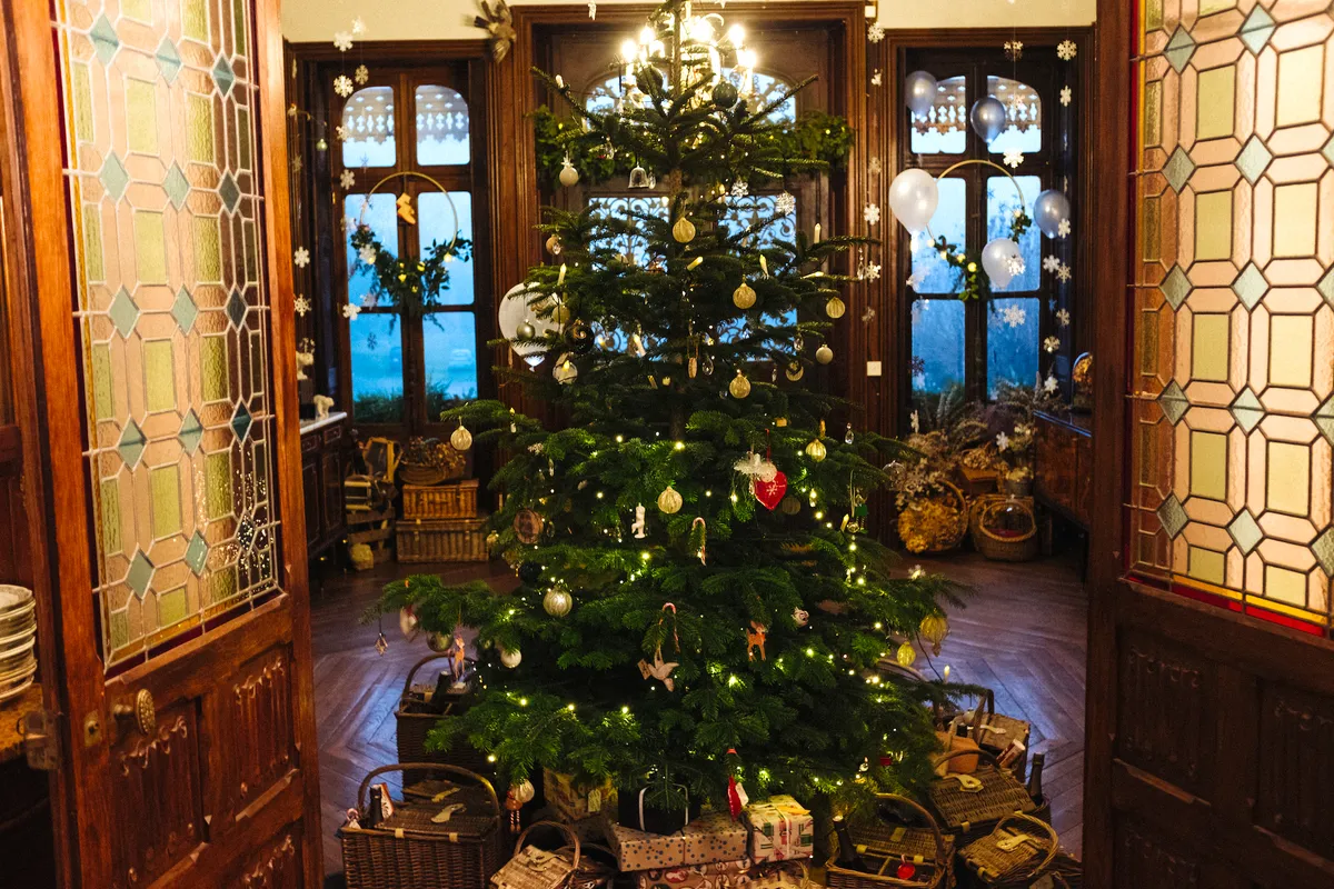 A large decorated Christmas tree at the Chateau de la Motte Husson
