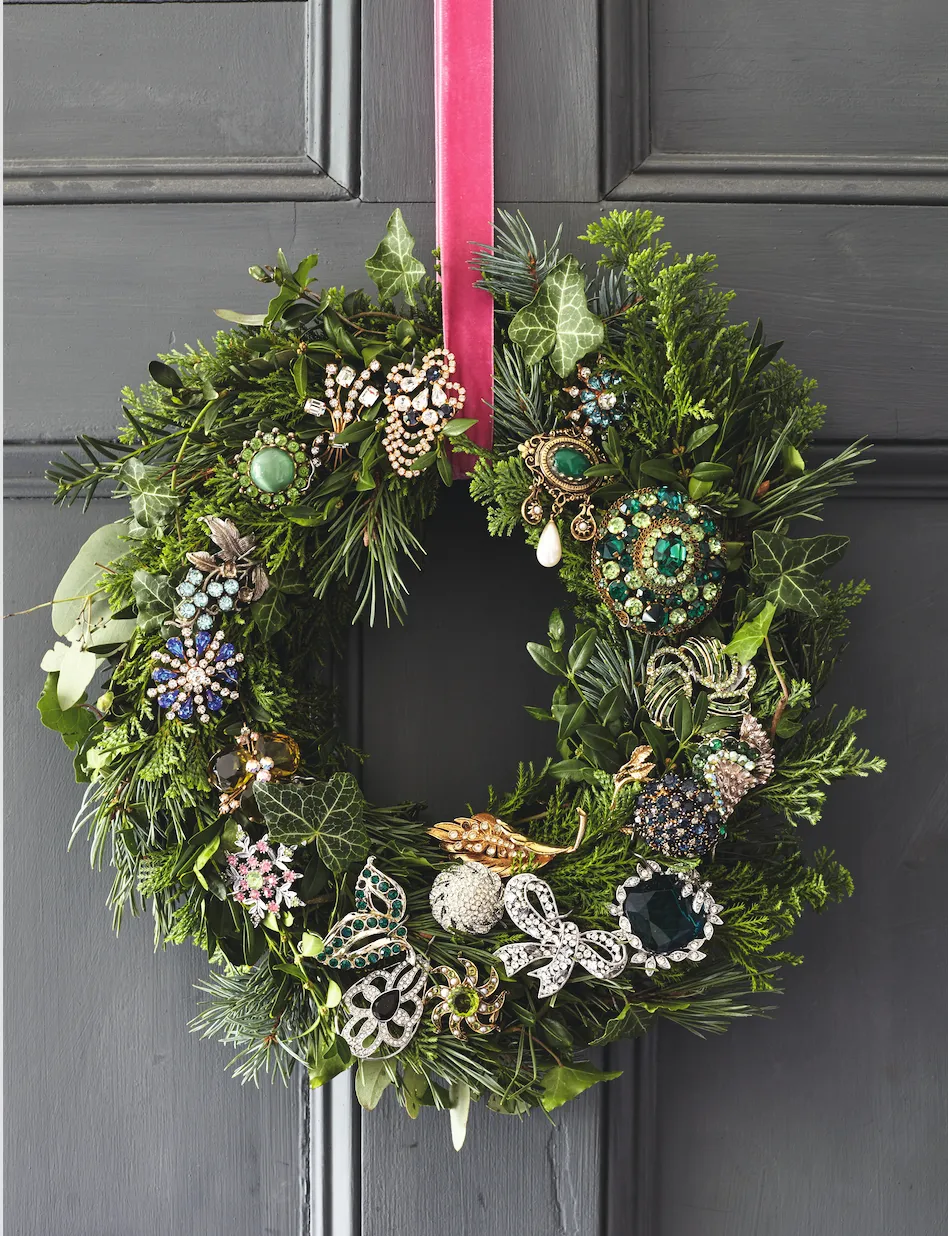 Handmade wreath, from £30, Winters Workshop. Vintage costume brooches from charity shops.