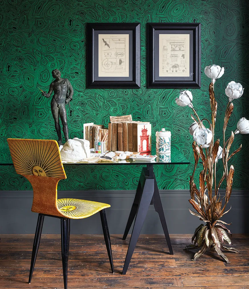 Home office with Fornasetti sole chair and Fornasetti Malachite wallpaper from Cole & Son