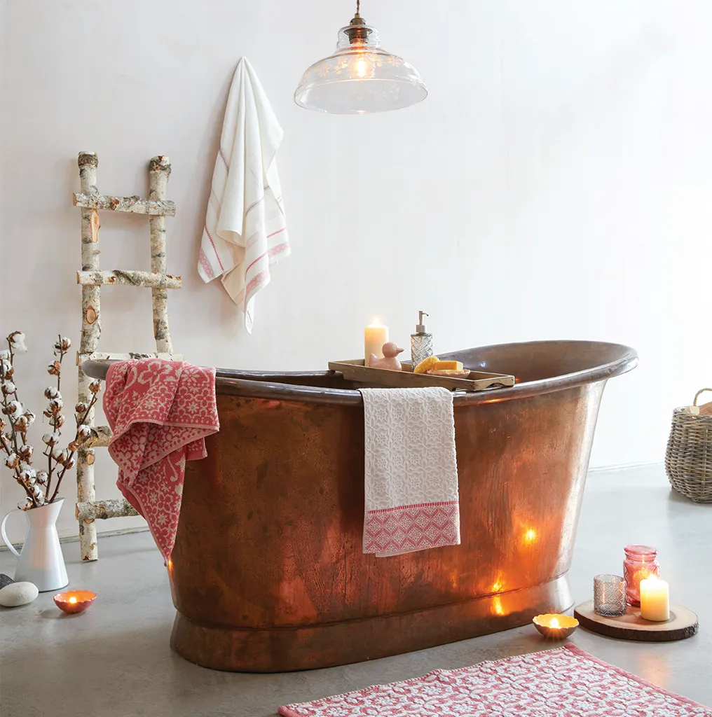 Dress your bathroom with candles and hammam towels such as these from Dunelm.
