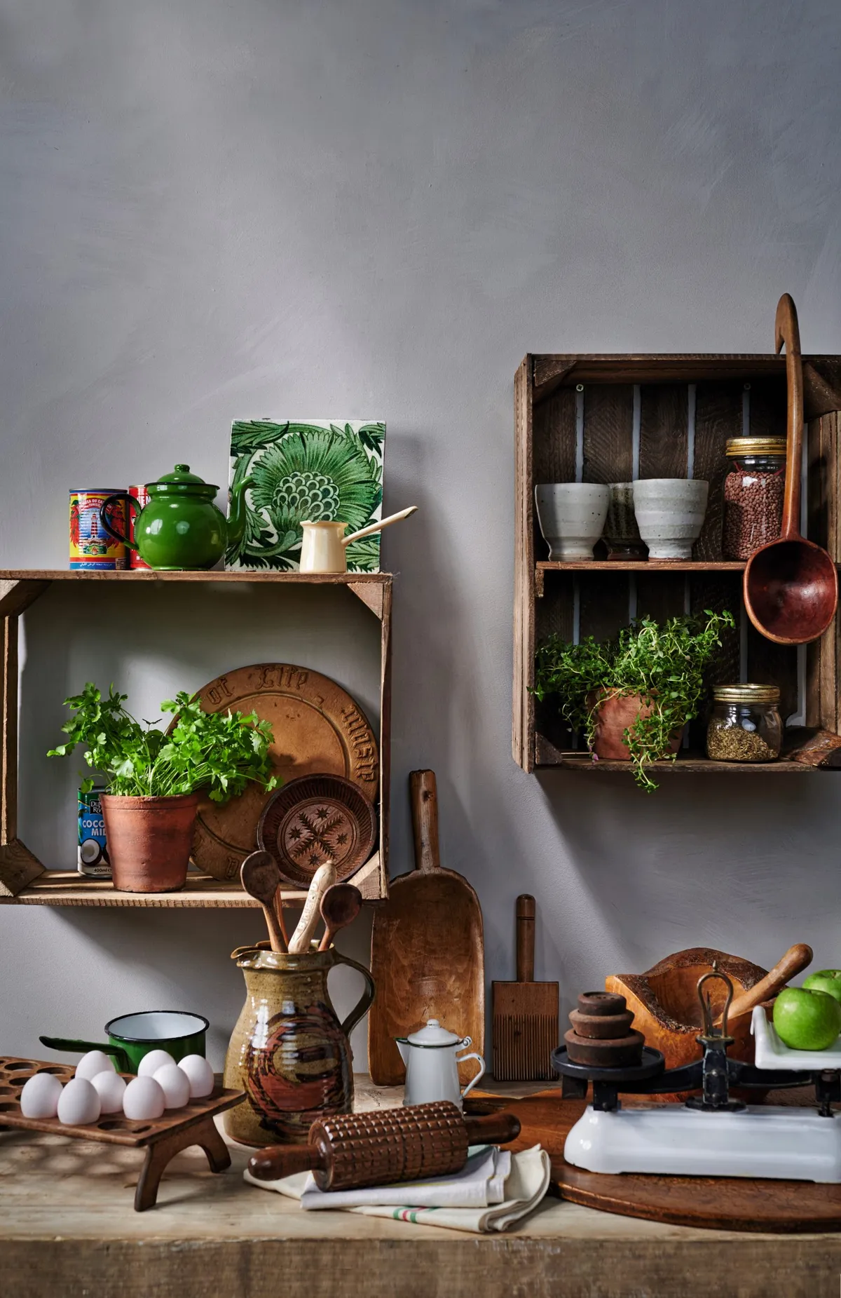 Upcycled old apple crates make charming shelves, either propped on another surface or hung on the wall. In a rustic kitchen they look wonderful filled with useful accessories and purely decorative pieces.