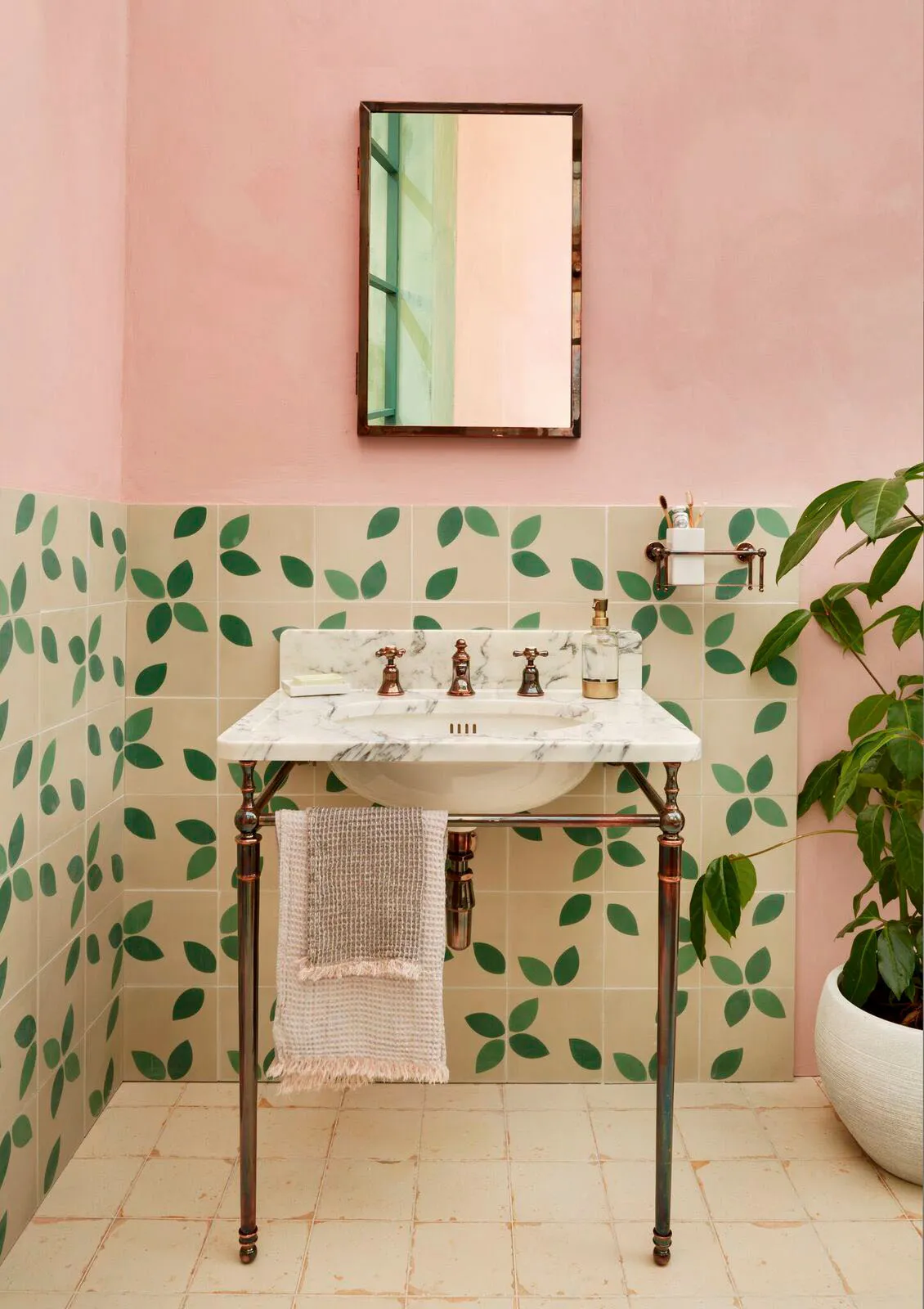 Orchard tiles in Basil/Cream from Marrakech Design in a pink bathroom with a traditional sink from Drummonds