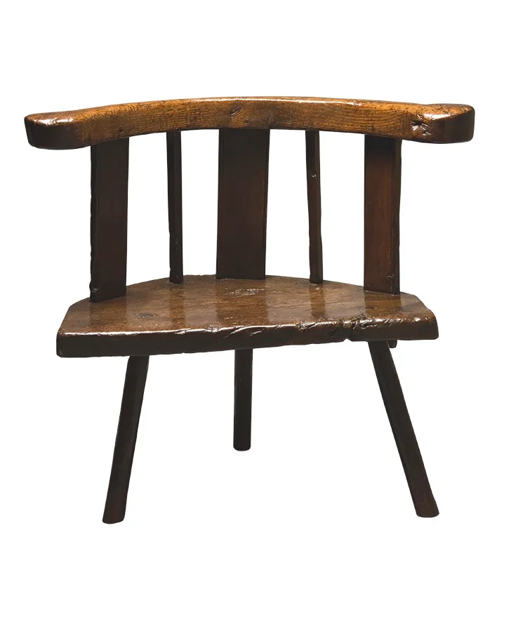 A Cardiganshire small chair with three wide arm supports.