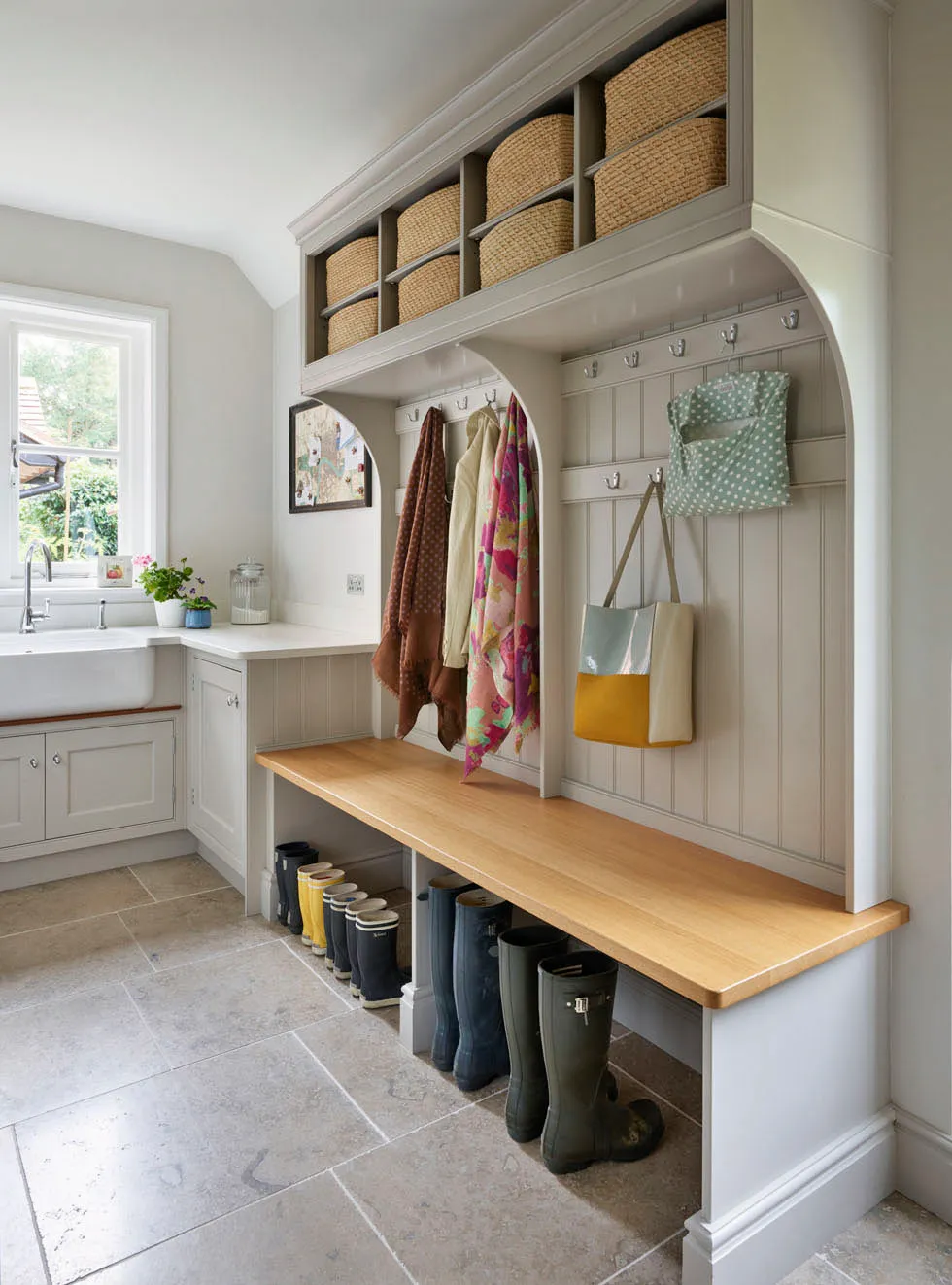 This project by Martin Moore incorporates the twin virtues of the boot room and the laundry room, with space to sit down while putting on and removing shoes.