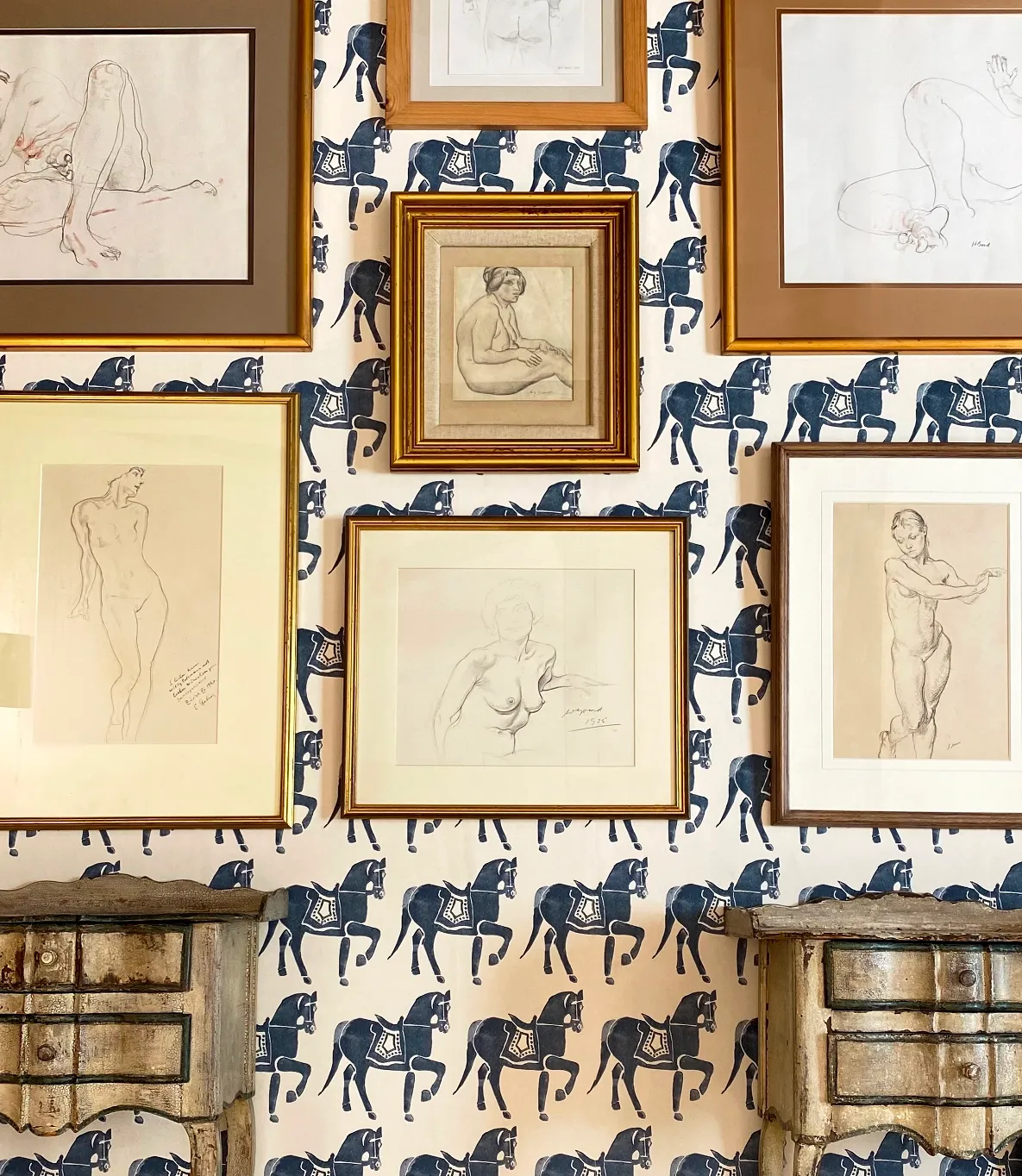 a selection of drawings, with estimates up to £100. Shot against Molly Mahon Marwari Horse wallpaper in Dark Blue