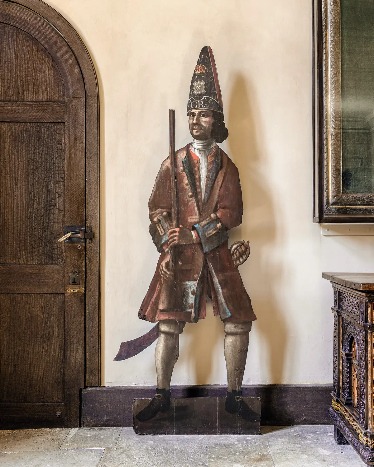 A Scots Guardsman in the Great Hall at Canons Ashby, Northamptonshire, which was painted by Elizabeth Creed between 1715 and 1717. © National Trust/Lynda Aiano