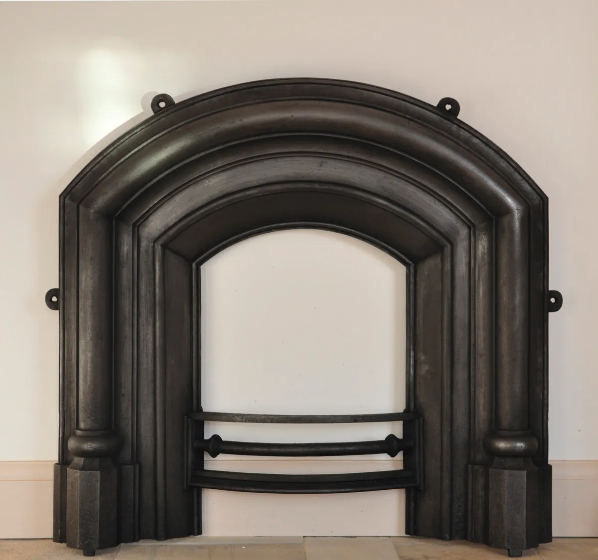 Antique Gothic cast-iron arched fireplace, approx mid 19th-century