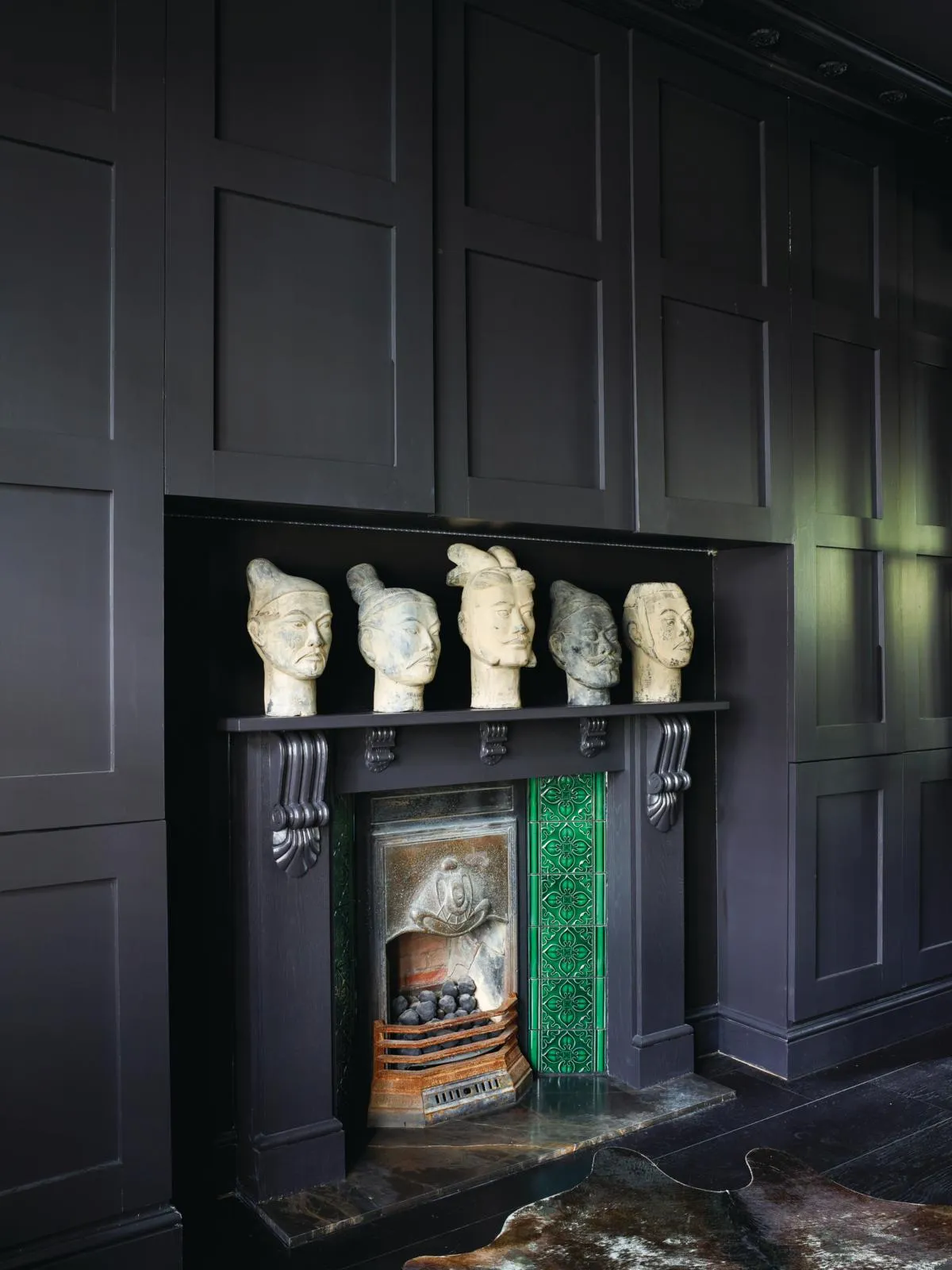 Victorian London flat, firplace with replica Chinese warriorhead display