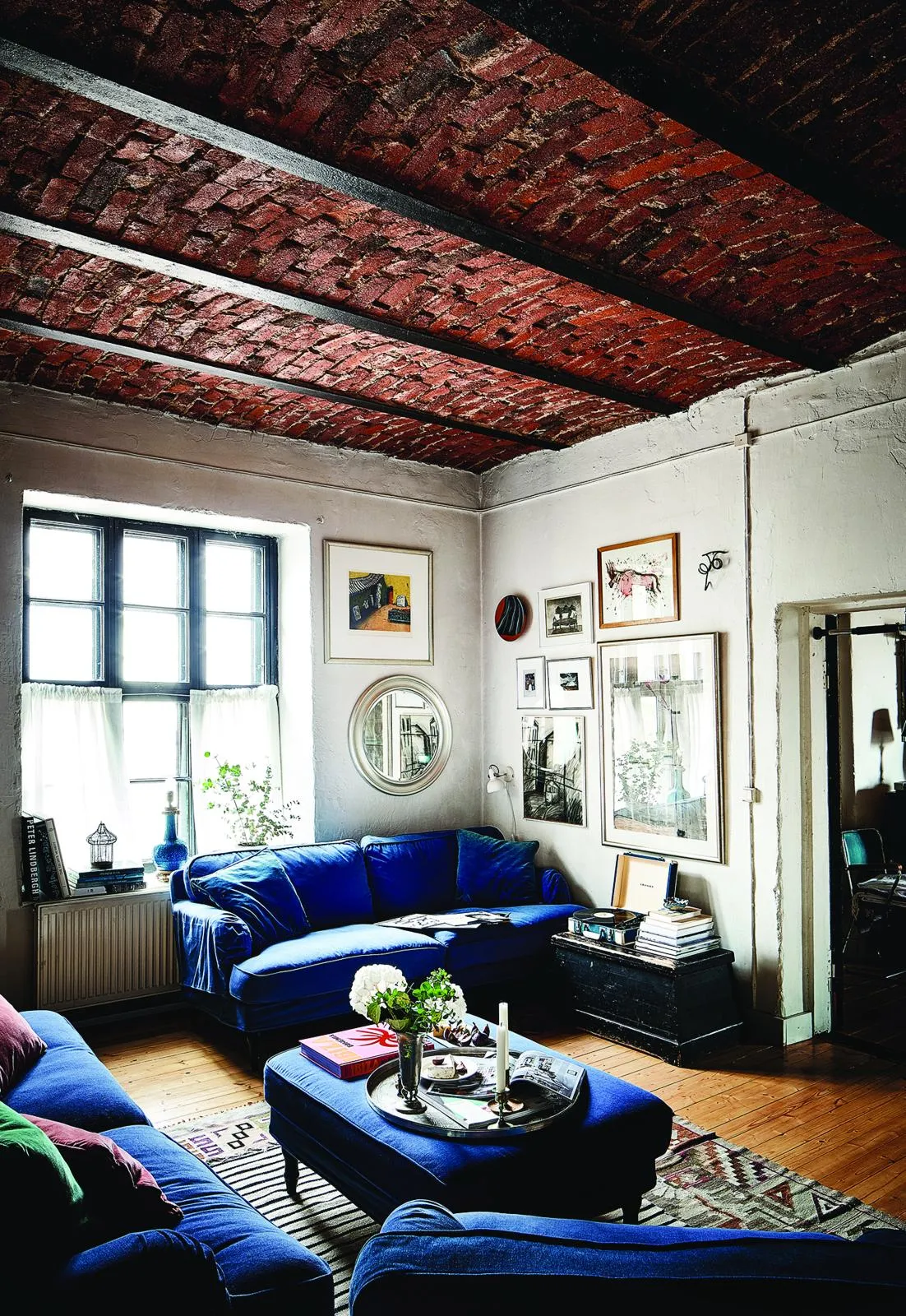 Finnish former factory home: blue sofa in the living room.