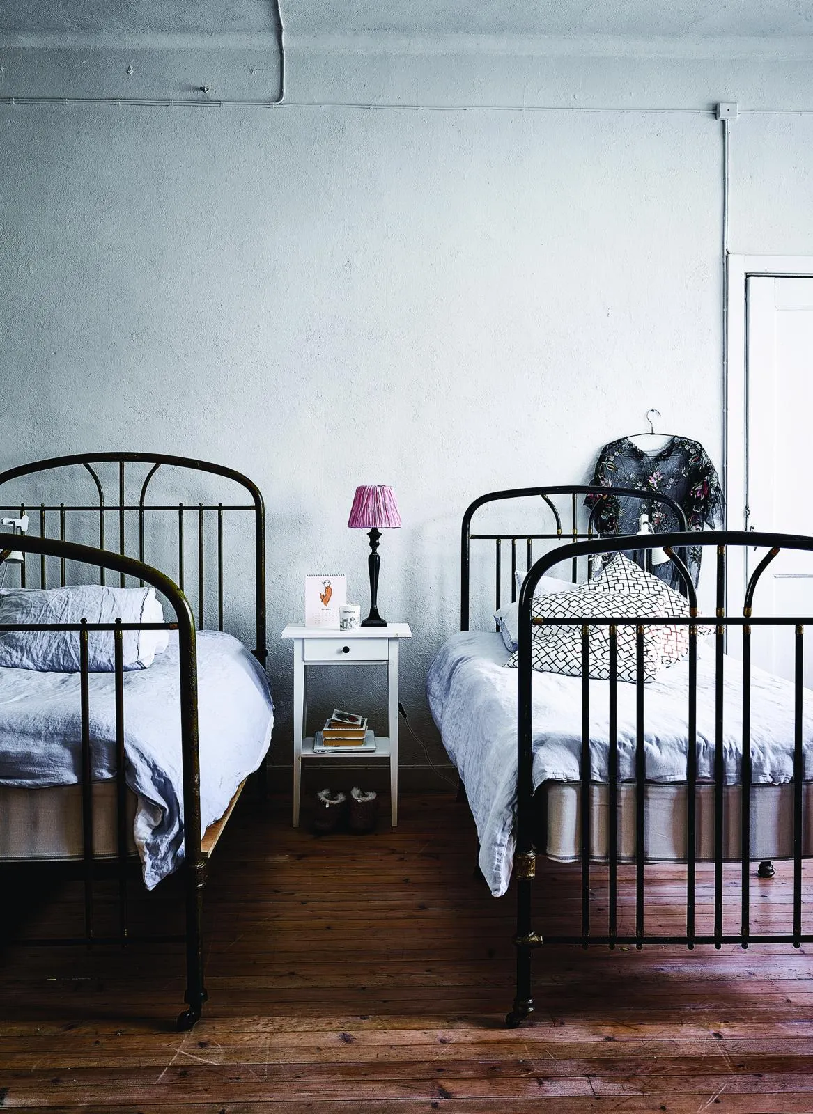 Finnish former factory home: iron beds in the childrens' bedroom.