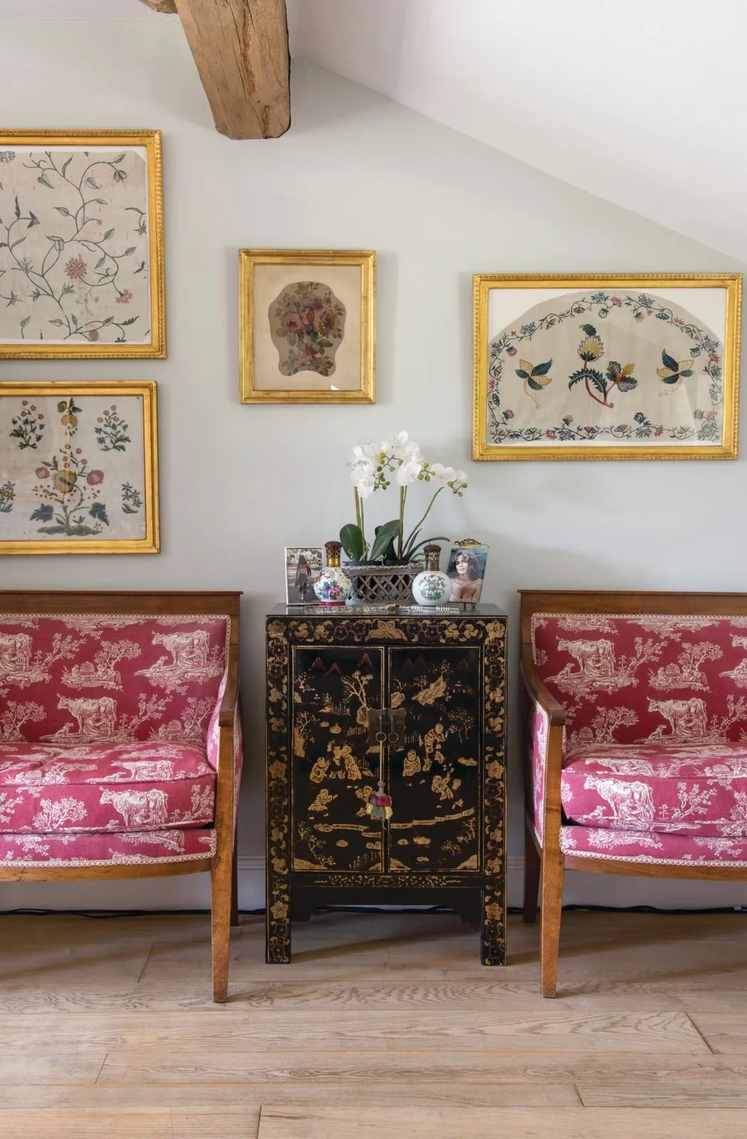 18th-century gamekeeper’s cottage, antique Marquise chairs and Chinese cabinet.