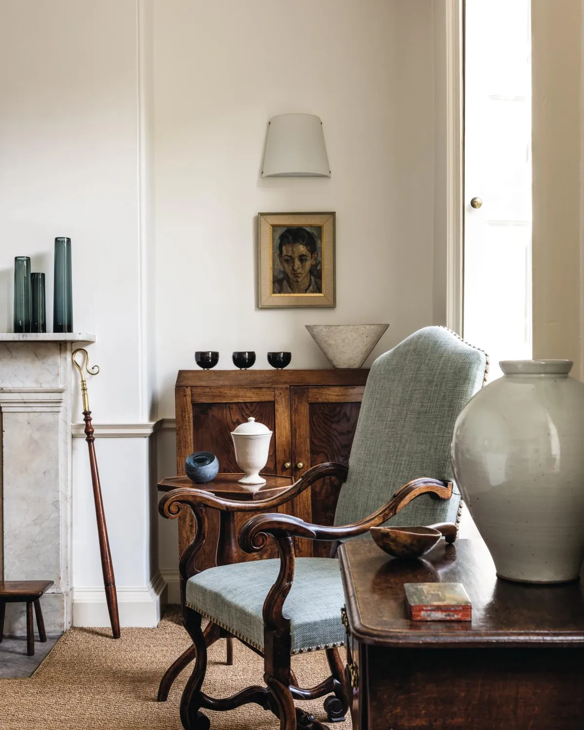 18th-century home, elm cupboard & French walnut armchair.