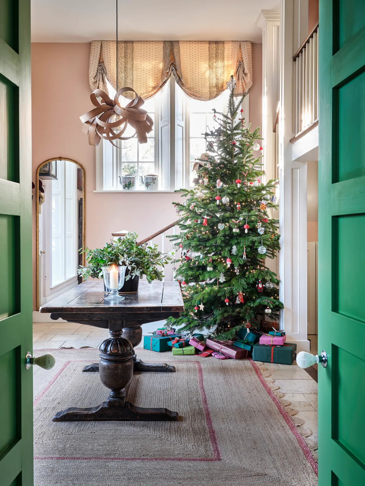 Elegantly eclectic home entrance hall xmas tree