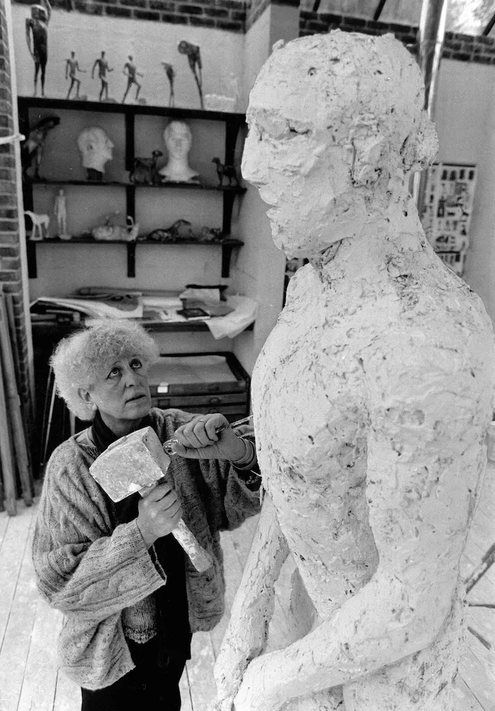 Elisabeth Frink working on the Dorset Martyr group, 1985. D-FRK/1/10/7/2/6
© Anthony Marshall/Courtesy of Dorset History Centre. Artist copyright in image kindly approved by Tully and Bree Jammet.
