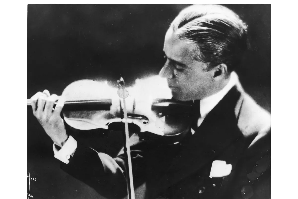 Charlie Chaplin playing the violin