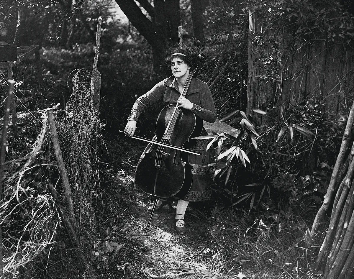 British cellist Beatrice Harrison (1892-1965) poses in a forest. (Photo by © Hulton-Deutsch Collection/CORBIS/Corbis via Getty Images)