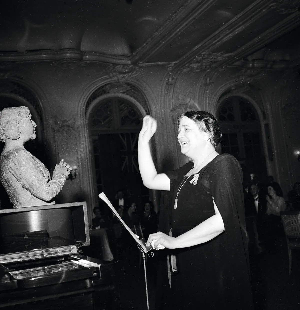 British pianist Dame Myra Hess (1890 - 1965) conducts Haydn's'Toy Symphony' of toy musical instruments at the National Gallery, London, 14th July 1945. On the left is a new bust of Hess by Jacob Epstein. Original publication: Picture Post - 2031- Toy Symphony - pub. 1950 (Photo by Jack Esten/Hulton Archive/Getty Images)