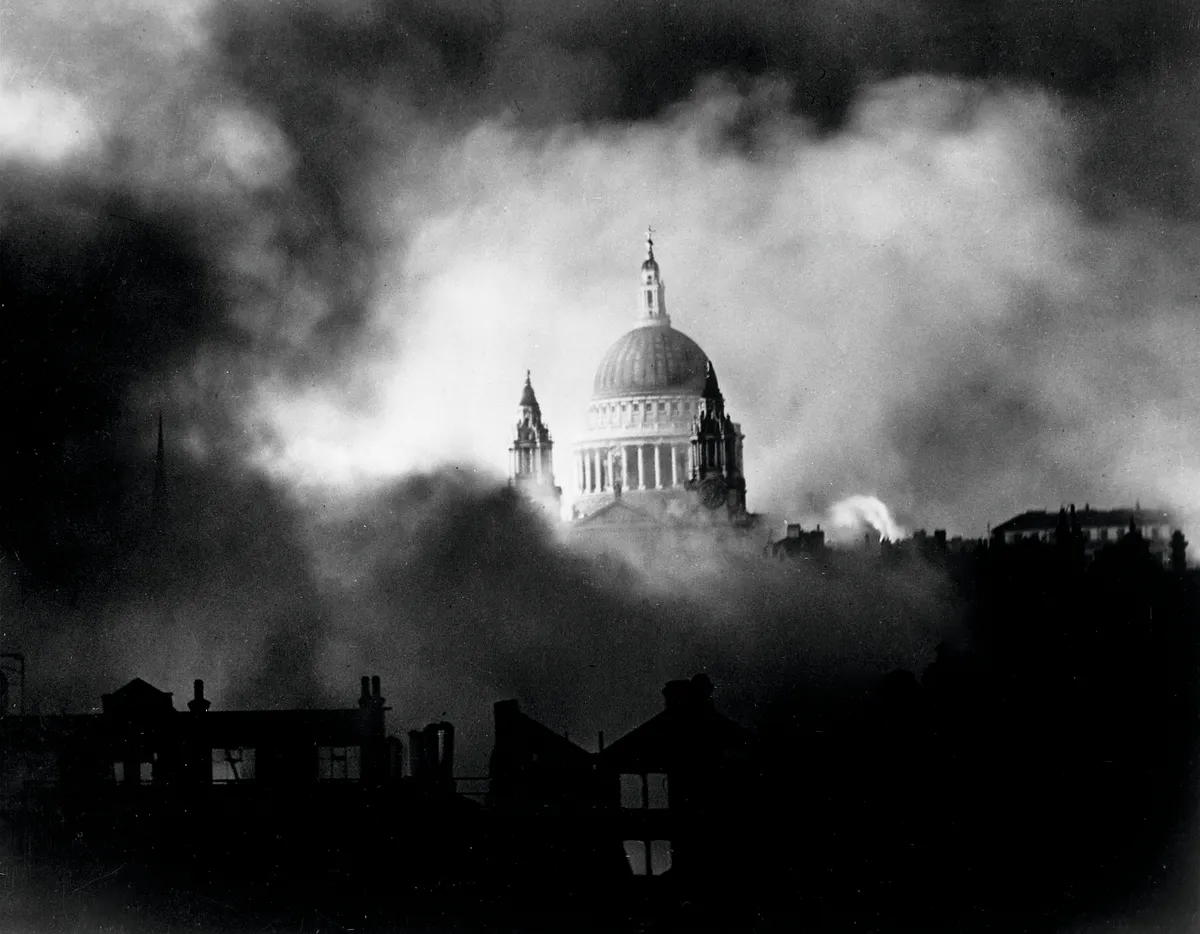 St. Paul's Cathedral standing gloriously out of flames & smoke of surrounding bldgs. during great fire raid by Germans. (Photo by Time Life Pictures/New York Times Paris Bureau Collection/National Archives/The LIFE Picture Collection/Getty Images) Additional permissions required for merchandise and/or resale products; fine art prints; gallery, nonprofit or museum displays; or theatrical live performances. Contact your local Getty Images office.