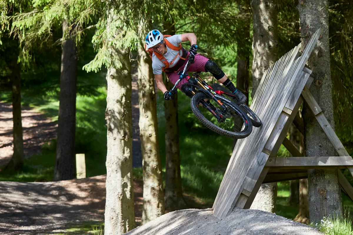Tracy Moseley schooled MBUK at the Glentress freeride park, hitting the wallride with ease! Credit: Steve Behr