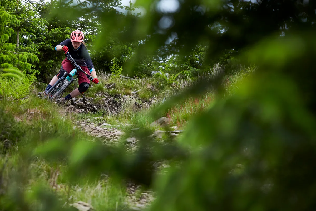 Martha Gill has style for miles as she hits one of the enduro trails. Credit: Steve Behr