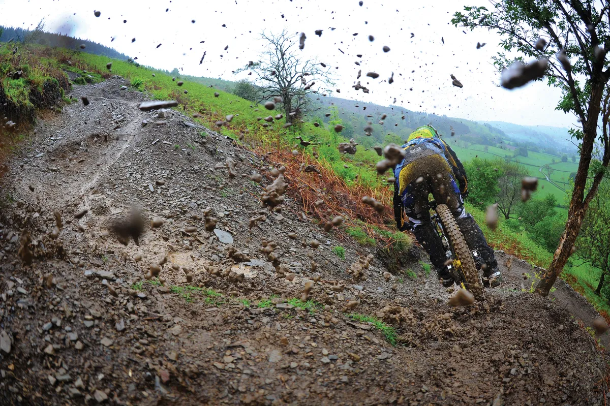 This is why we love Sam Hill, ripping and roosting turns, no matter what the weather is doing. Photo: Andy Lloyd