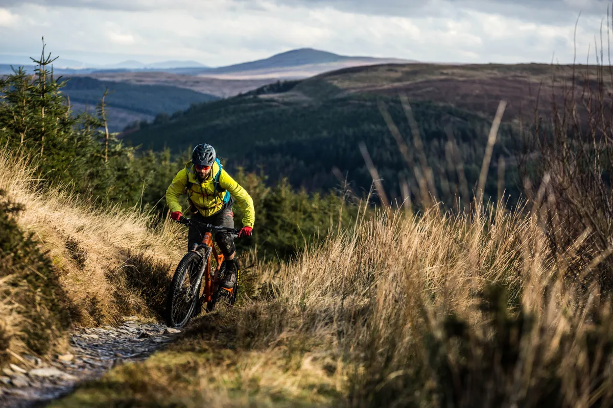 Alex Evans rides the climb on the Dolen Machno trail at Penmachno for a MBUK Wrecking Crew feature