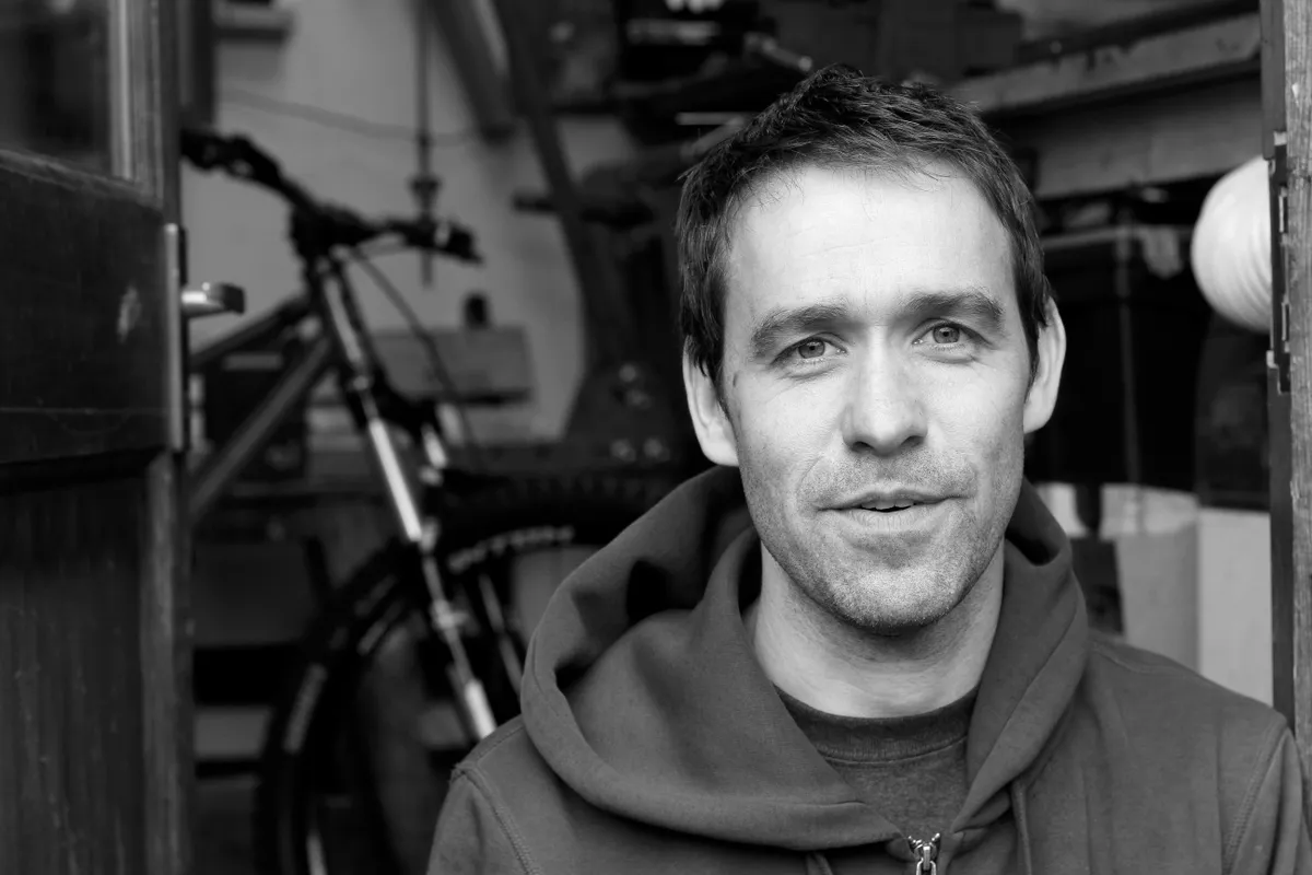 A portrait photograph of Joe McEwan, the founder of Starling Cycles