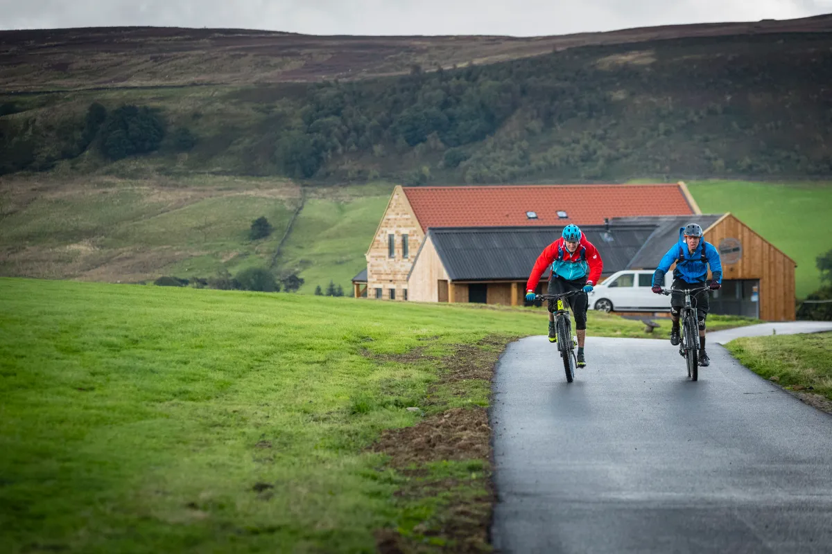 Max Darkins and Phil Thurlow ride away from the Yorkshire Cycle Hub at the start of MBUK's big ride in the North York Moors