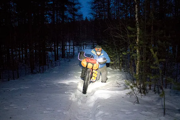 Pushing a bike through deep snow