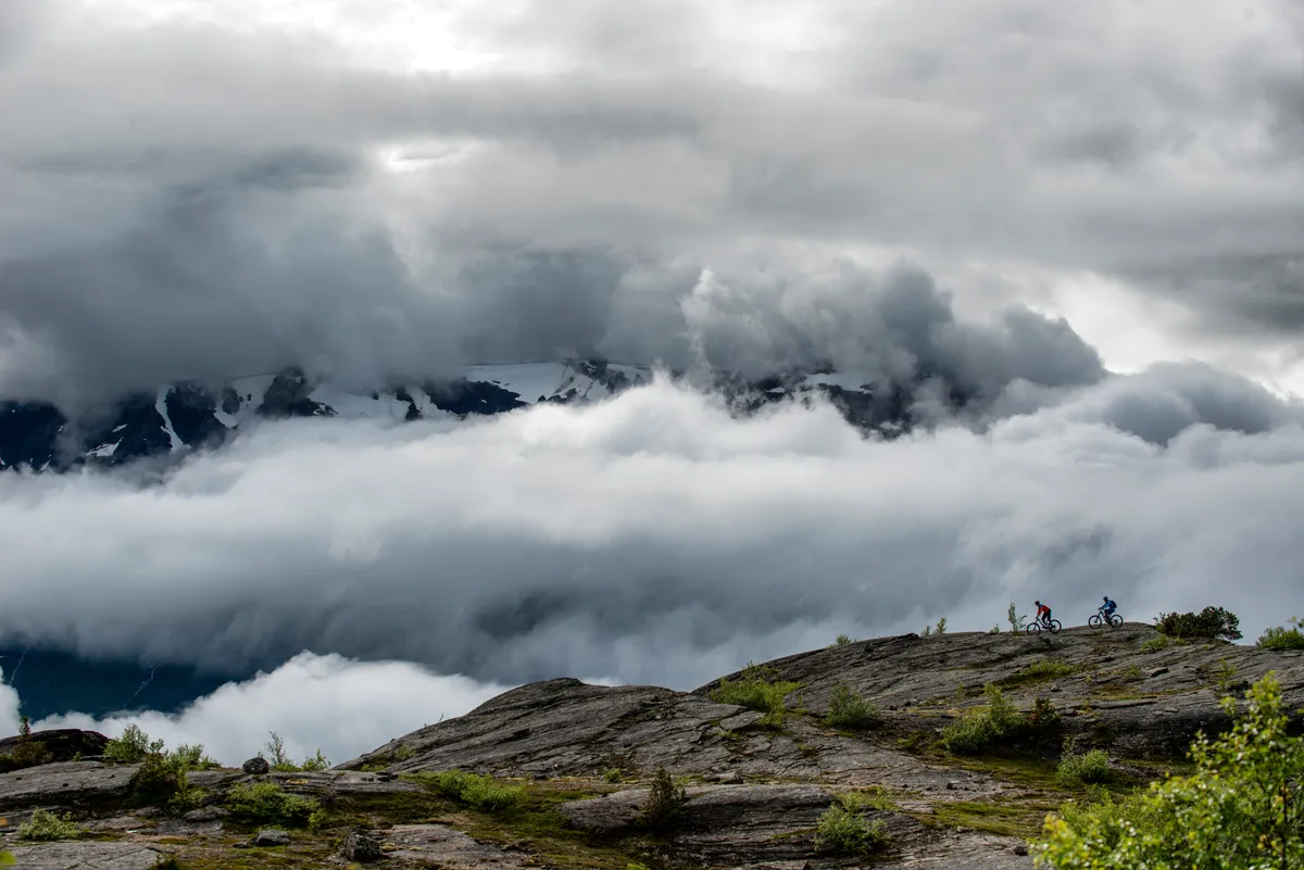 Ed Thomsett and Thomas Klingenberg ride through the clouds in Skibotn, Norway