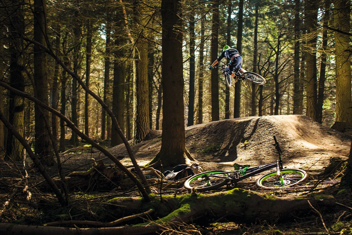 A rider hits a table top jump at Forest of dean