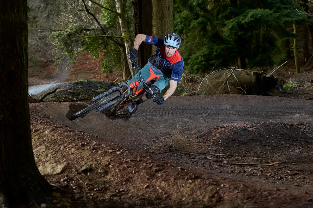 Olly Morris rides a corner in the Forest of Dean