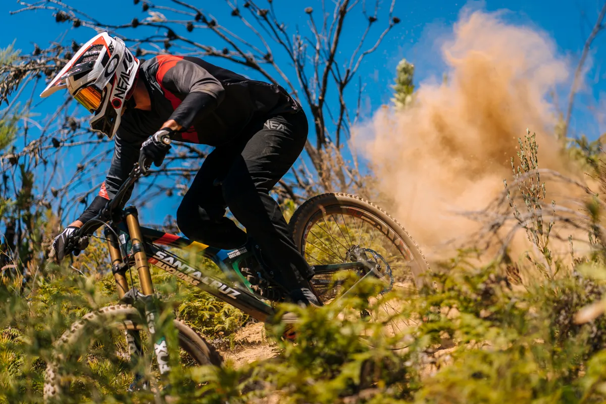 Greg Minnaar rides a dusty corner on his Santa Cruz V10 in Stellenbosch, South Africa