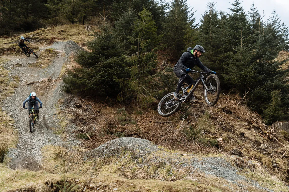 Adam Brayton does a jump at Grizedale trail centre