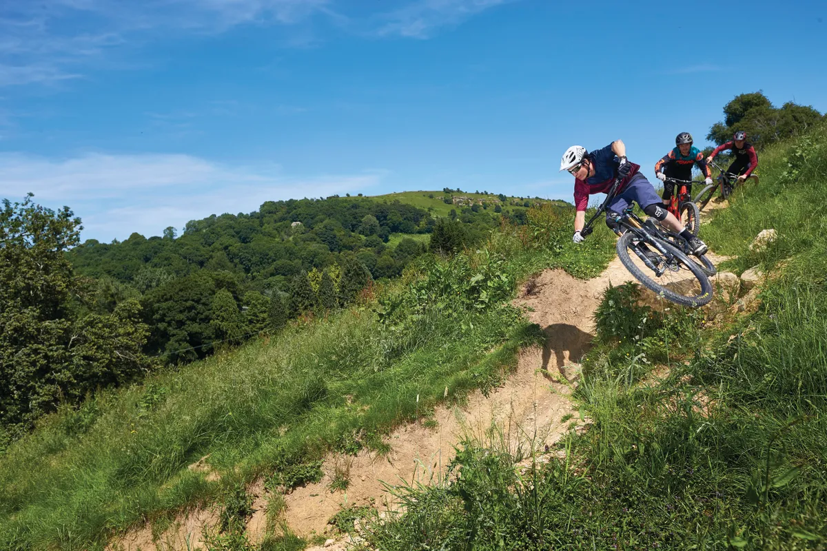 Jonny Ashelford riding a Specialized Stumpjumper , James Van Gawler riding a Giant Reign and Luke Marshall riding a Yeti mtb. 417 Bike Park. Witcombe, Gloucestershire. June 2018.